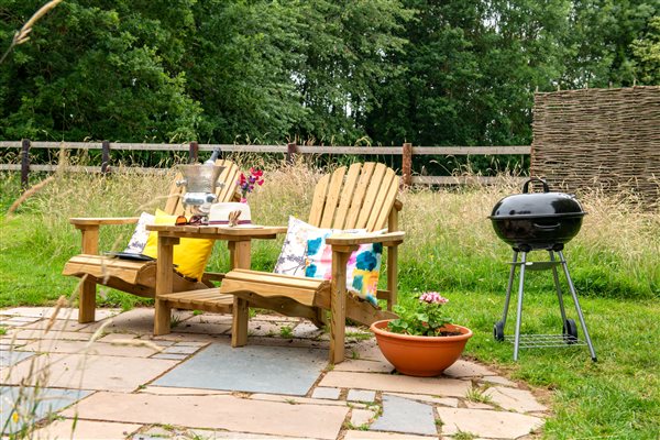 Outdoor sun loungers and BBQ on the patio